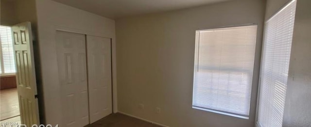 unfurnished bedroom featuring a closet