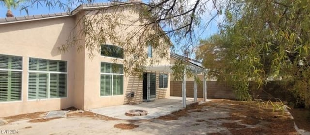 back of property with a patio area