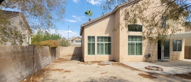 view of side of home featuring a patio area