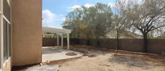 view of yard with a patio and a pergola