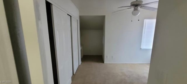 hallway with light colored carpet