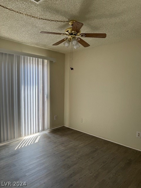 unfurnished room featuring ceiling fan, a textured ceiling, and dark hardwood / wood-style flooring