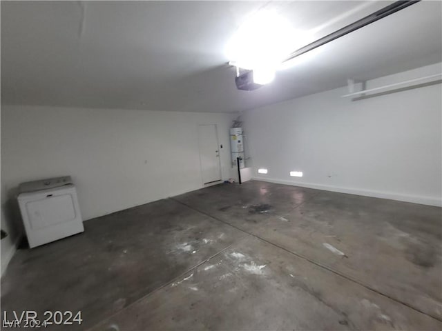 garage featuring washer / clothes dryer, a garage door opener, and secured water heater