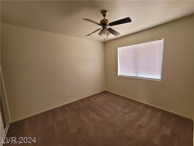 carpeted empty room with ceiling fan