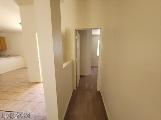 hallway featuring light tile patterned floors