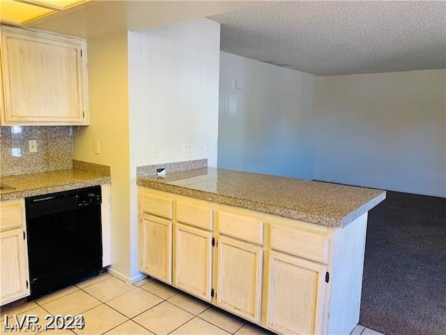 kitchen with light tile patterned floors, kitchen peninsula, black dishwasher, tasteful backsplash, and a textured ceiling