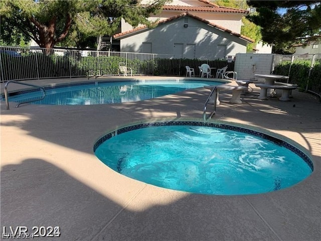 view of swimming pool featuring a patio