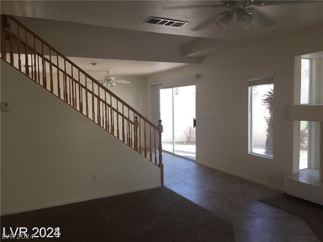 tiled entrance foyer with ceiling fan