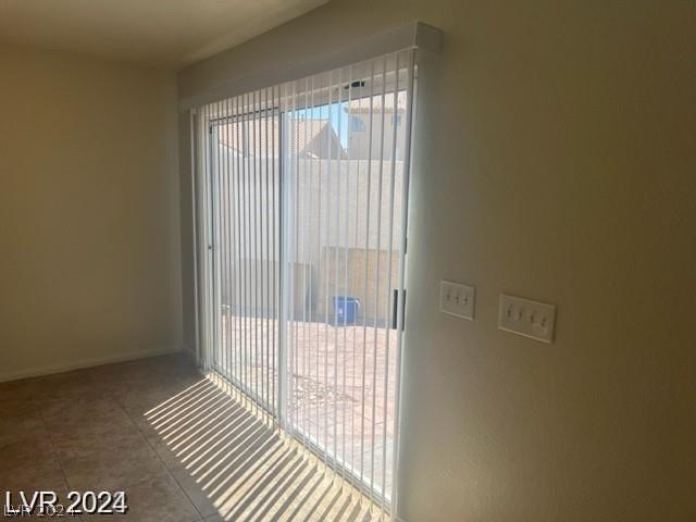 doorway featuring tile patterned flooring