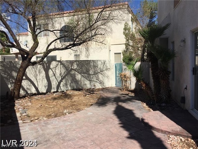 view of side of home featuring a patio