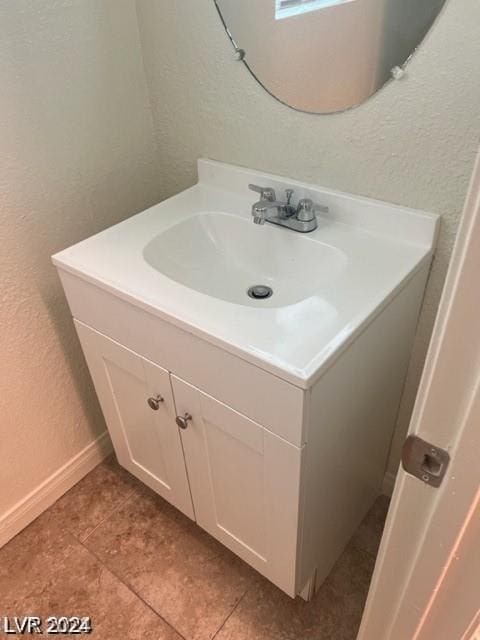 bathroom with vanity and tile patterned flooring