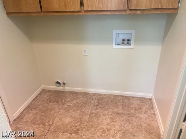 washroom featuring cabinets and hookup for a washing machine