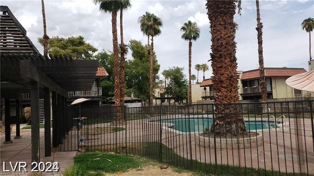 view of swimming pool featuring a pergola and a patio