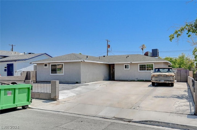 ranch-style home with cooling unit