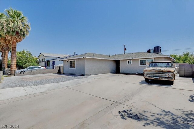 single story home with central air condition unit