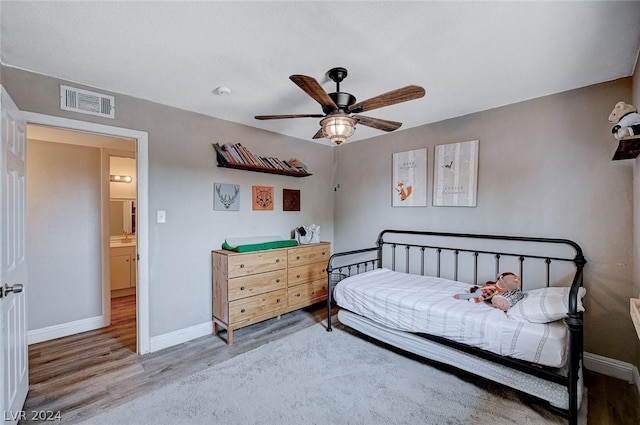 bedroom with ceiling fan and hardwood / wood-style floors