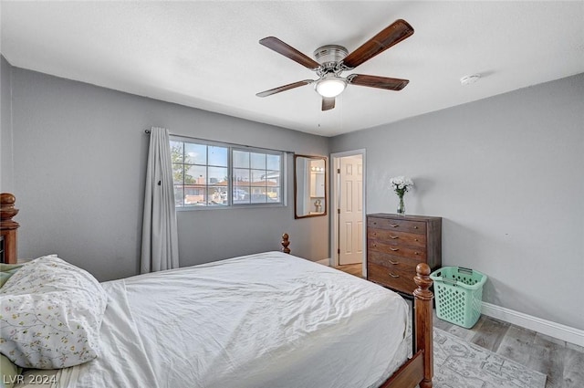 bedroom featuring light wood-type flooring and ceiling fan