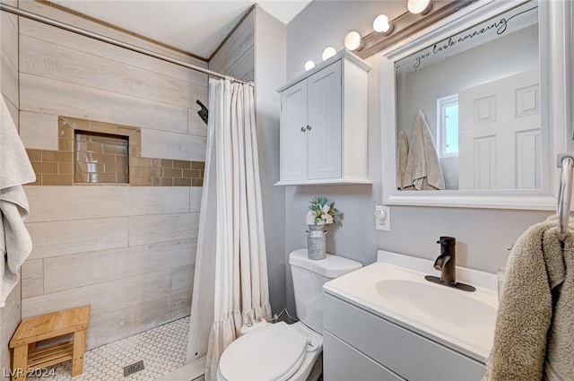 bathroom with a shower with curtain, vanity, and toilet