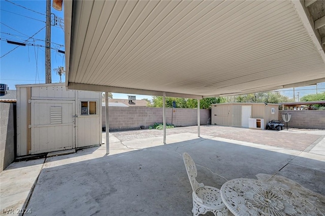 view of patio / terrace featuring a shed