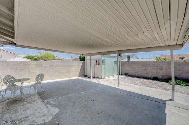 view of patio featuring a shed