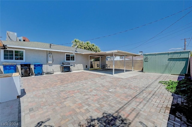 rear view of house with a carport