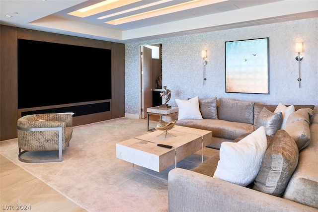 living room featuring a tray ceiling