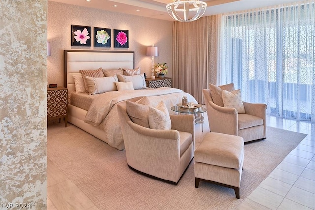 bedroom featuring tile patterned flooring and an inviting chandelier