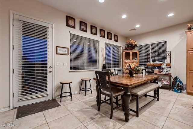 dining area featuring light tile patterned floors, visible vents, baseboards, and recessed lighting