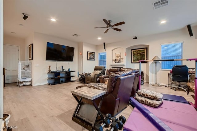 living room featuring ceiling fan, wood finished floors, visible vents, and recessed lighting