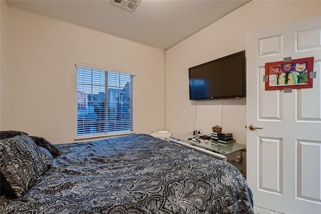 bedroom featuring visible vents