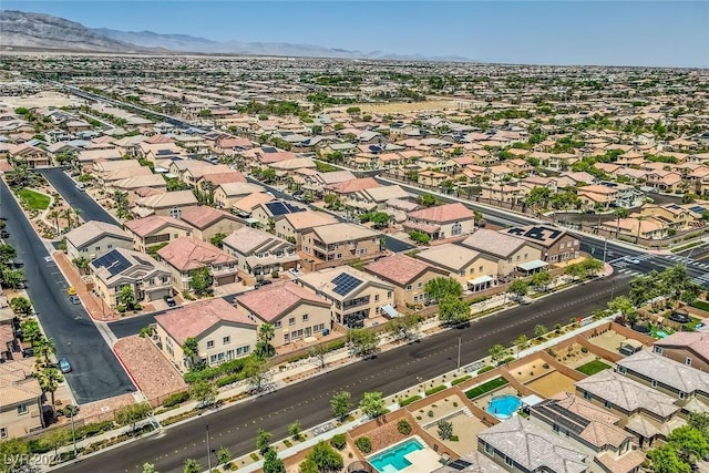 drone / aerial view featuring a residential view and a mountain view