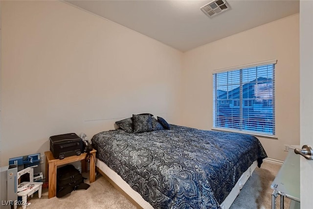 bedroom with visible vents and carpet flooring