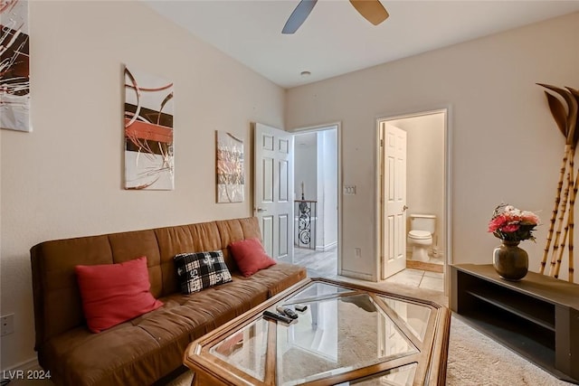 living area with a ceiling fan