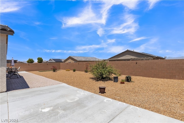 view of yard with a patio and a fenced backyard