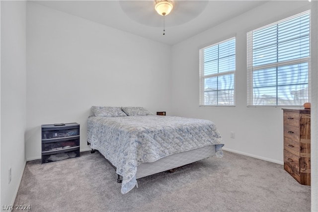 bedroom featuring carpet floors, a ceiling fan, and baseboards