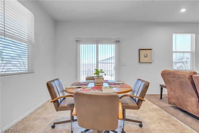 dining area featuring recessed lighting, baseboards, and light tile patterned floors