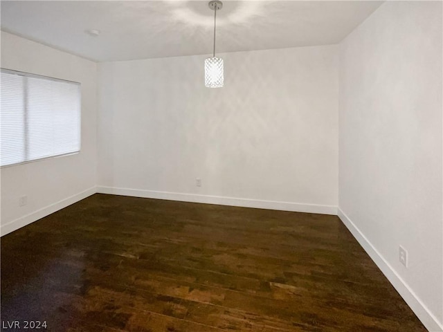 unfurnished room featuring dark hardwood / wood-style floors