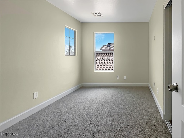 empty room with carpet flooring