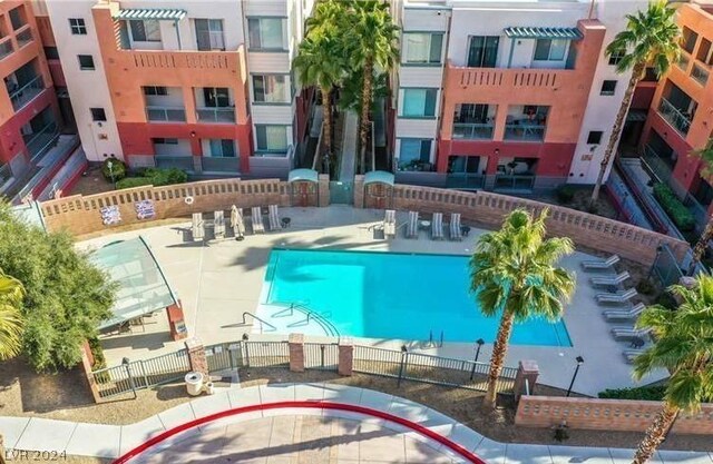 view of swimming pool featuring a patio area