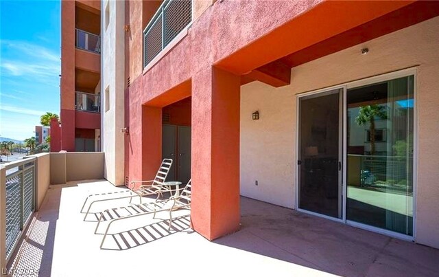 view of patio featuring a balcony