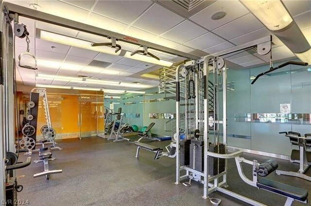 workout area featuring a drop ceiling