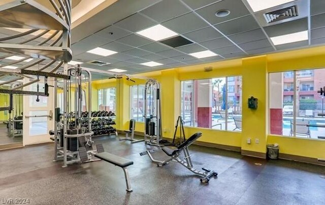 workout area featuring a paneled ceiling