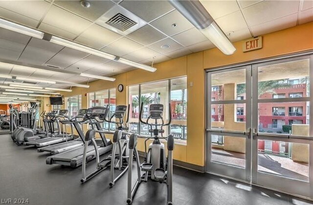 workout area with a paneled ceiling