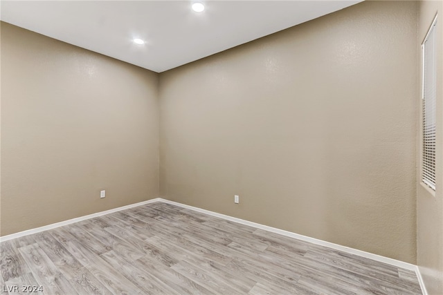 unfurnished room with light hardwood / wood-style flooring