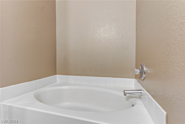 bathroom featuring a washtub