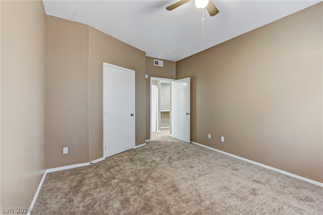 unfurnished bedroom with carpet floors and ceiling fan