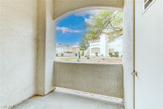 view of patio featuring a balcony