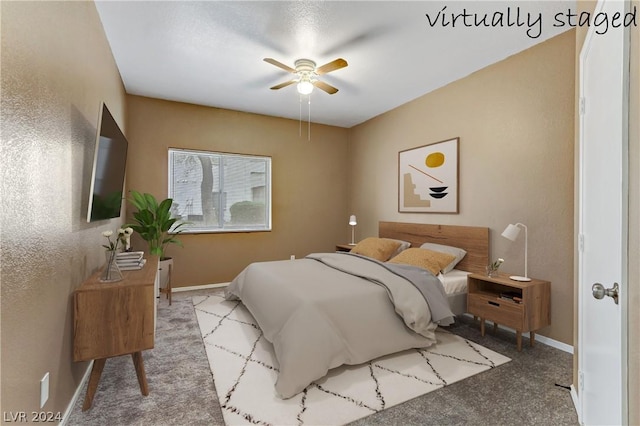 bedroom featuring baseboards and ceiling fan