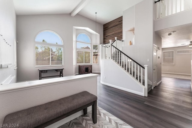 stairway featuring hardwood / wood-style flooring, high vaulted ceiling, beam ceiling, and ceiling fan