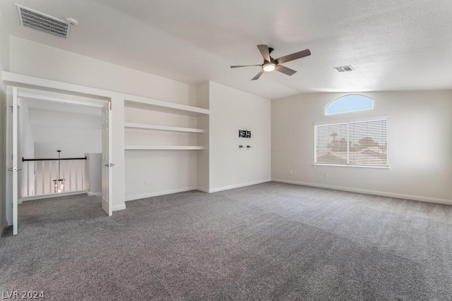 unfurnished bedroom featuring vaulted ceiling, ceiling fan, and carpet